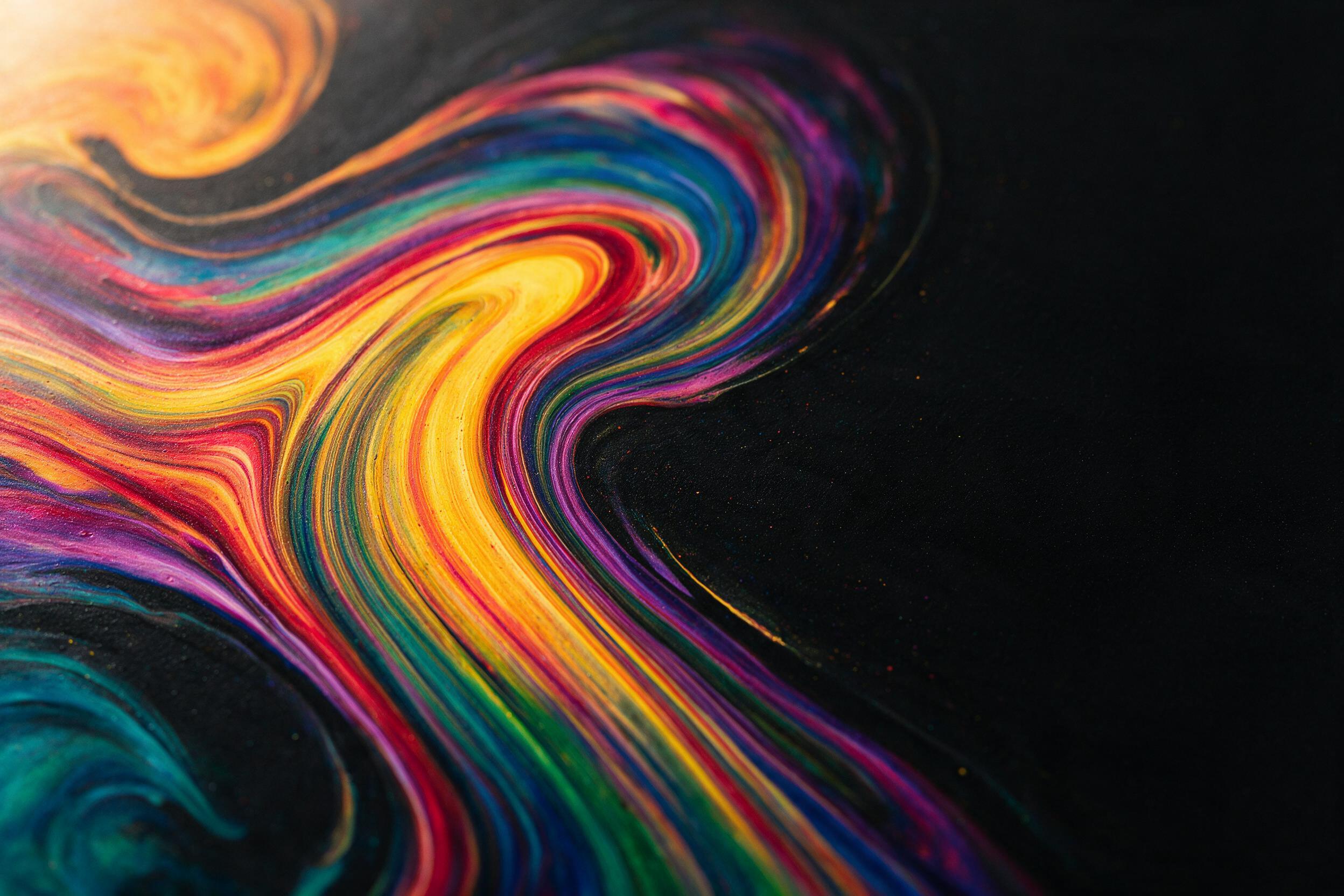 Multicolored acrylic paint swirls on a black canvas, dynamic fluid art patterns, soft gradient lighting from the top-left corner, shallow depth of field, no sharp edges, minimal composition with negative space, subtle texture of dried paint layers