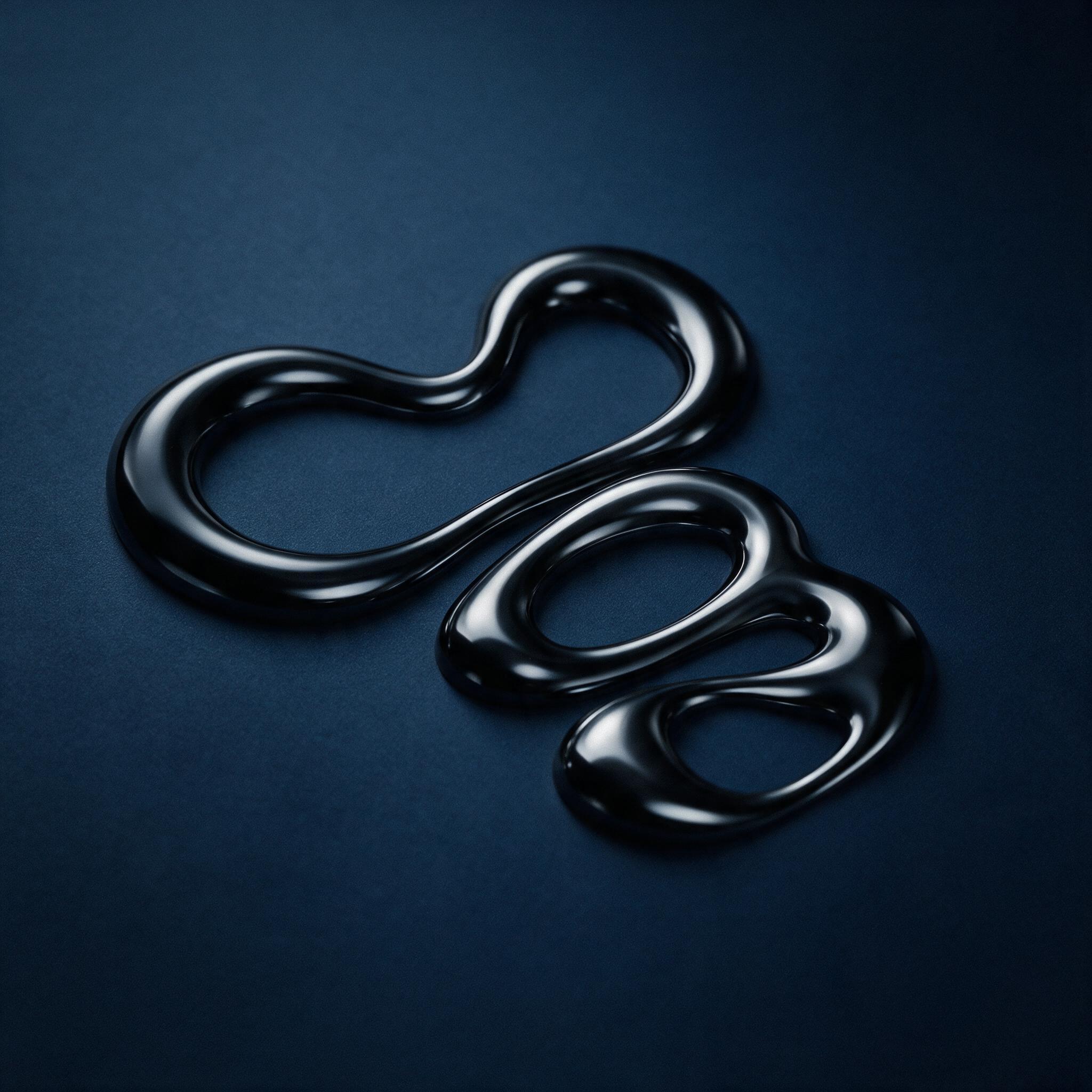 Glossy black liquid metal curls fluidly against a matte deep indigo background, soft studio lighting creating gentle highlights, subtle grain, minimal composition with negative space, no text, sharp focus on the central flow