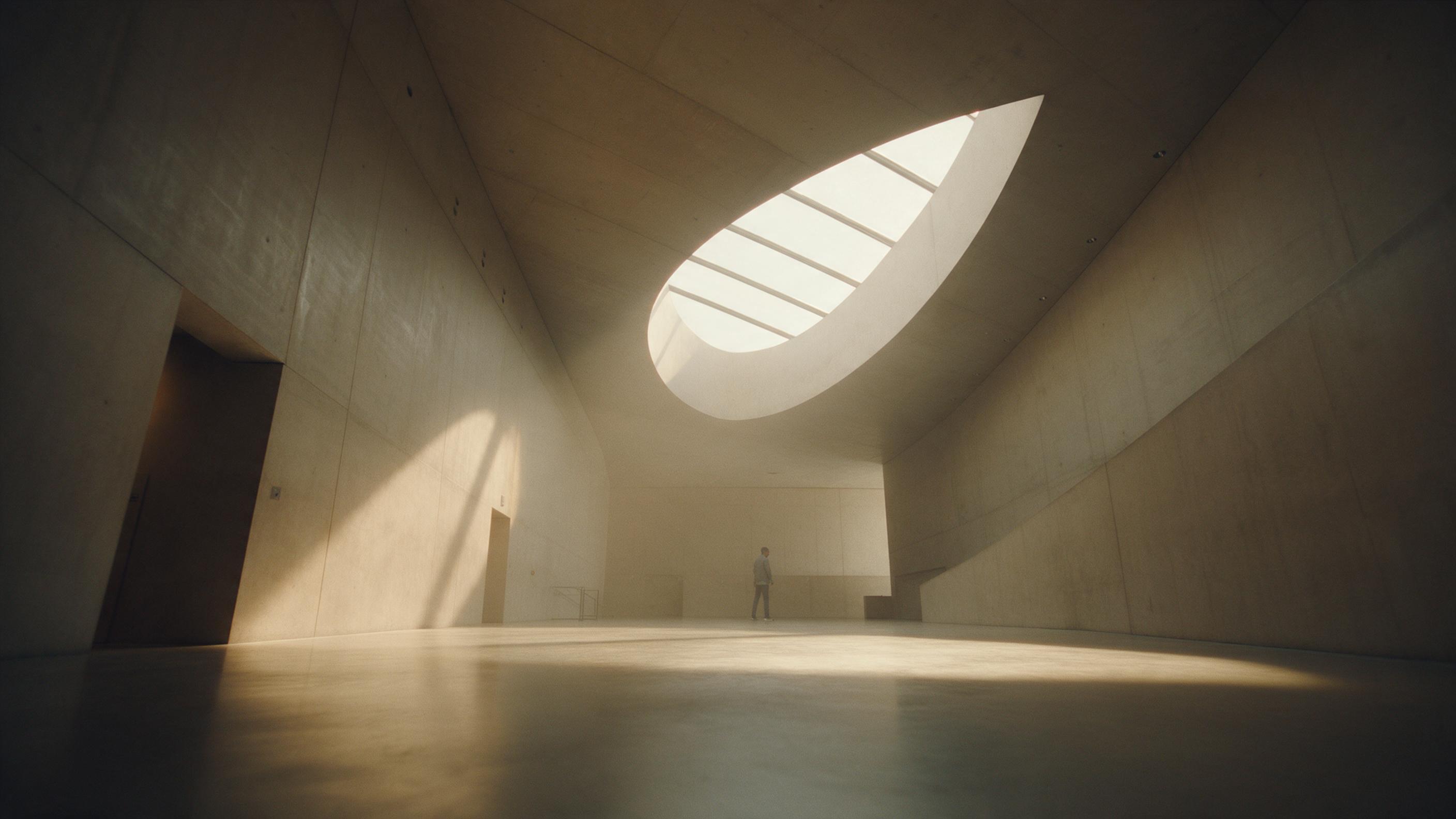 A minimalist concrete museum interior with a single curved skylight casting warm afternoon light across polished floors, shadows stretching along the wall, a lone visitor standing in the distance, muted earth tones, soft haze in the air, wide-angle composition emphasizing vertical lines, subtle film