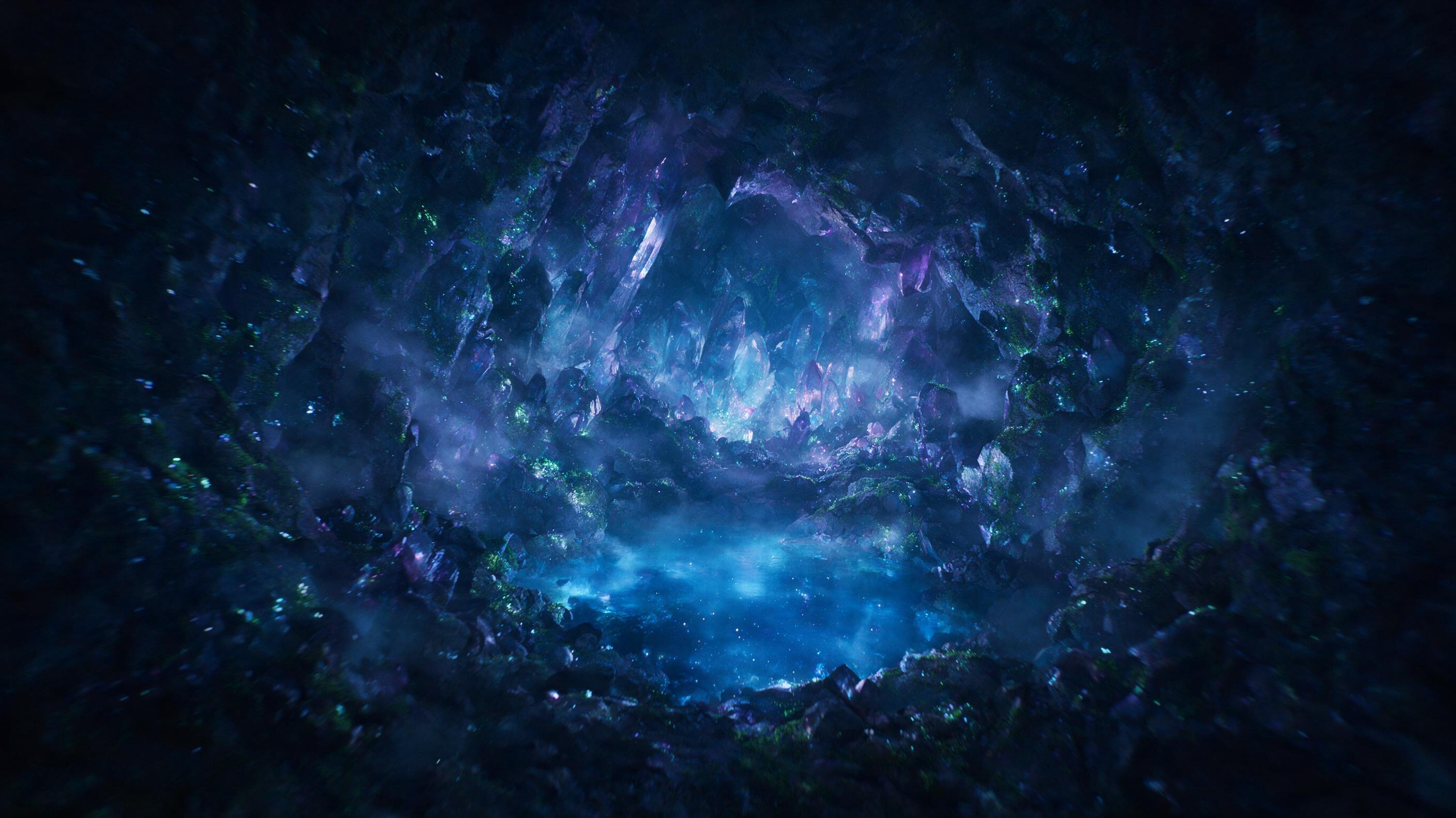 A luminous crystal cave deep underground, bioluminescent moss clinging to jagged walls, a pool of glowing blue water reflecting faint star-like lights, soft mist swirling, slight camera shake from a handheld exploration, moody dark blue and purple hues