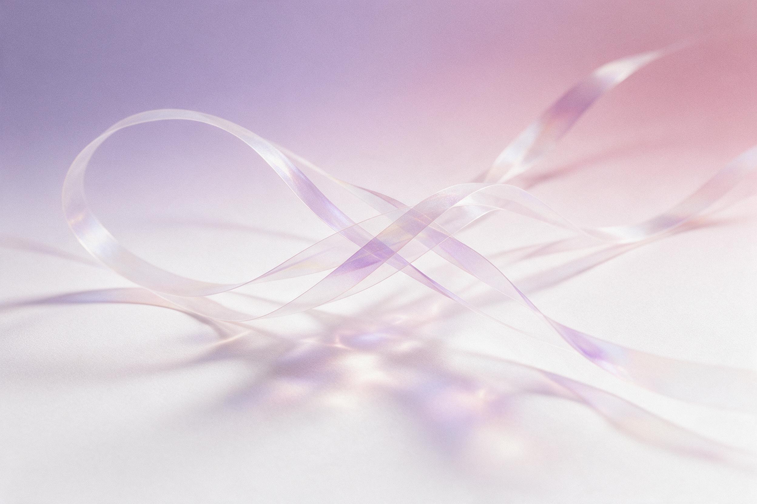 A minimalist composition of flowing translucent iridescent ribbons weaving through a soft gradient of muted lavender and dusty rose, gentle overhead diffused light casting subtle caustic reflections on a matte white surface below, smooth grain texture, shallow depth of field
