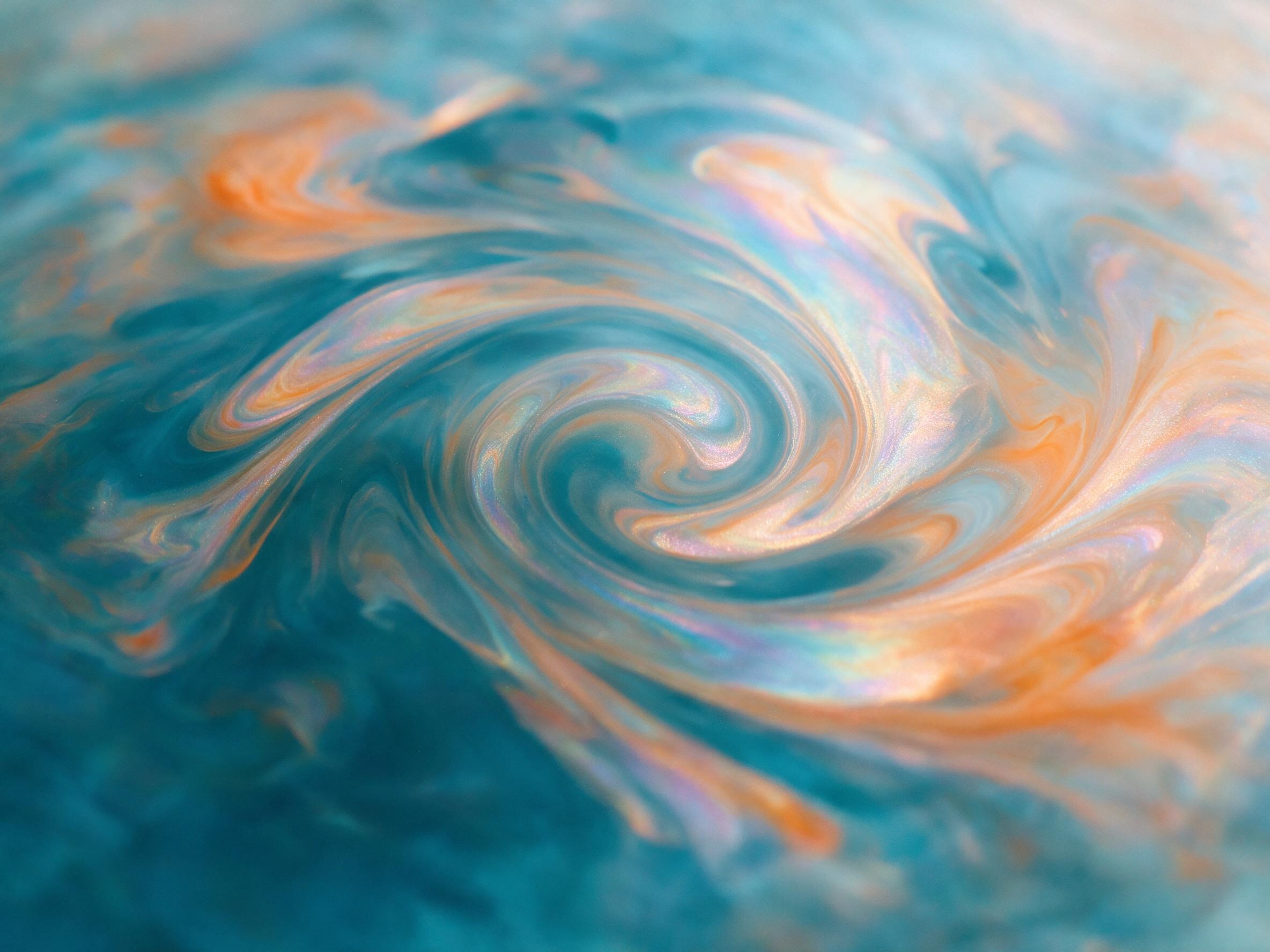 Fluid art composition with swirling iridescent oil patterns on water, deep cyan and burnt orange gradients, soft reflections, organic curves, macro shot, shallow depth of field, minimal noise, no text or sharp edges.